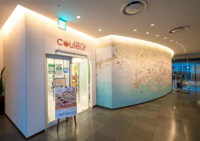 a store with a map on the wall in a building at Ours Inn Hankyu in Tokyo