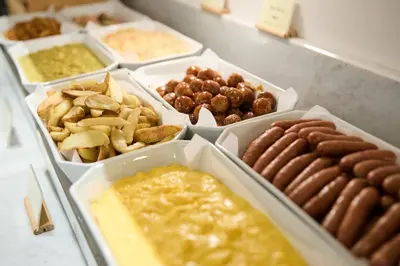 a table topped with trays of different types of food at Citadines Shinjuku Tokyo in Tokyo