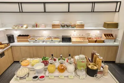a kitchen with a bunch of food on a counter at Citadines Shinjuku Tokyo in Tokyo