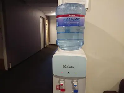 a bottle of water sitting on top of a blender at Residence Hotel Will Shinjuku in Tokyo
