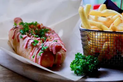 a hot dog and a basket of french fries at MOXY Tokyo Kinshicho in Tokyo
