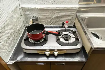 a pot on top of a stove in a kitchen at Shinjuku Apartment 103 in Tokyo