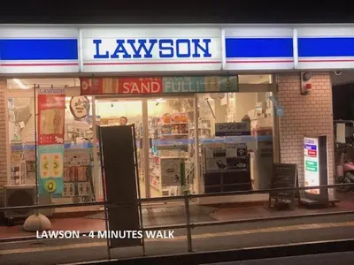a store front of a lawson store at Shinjuku Apartment 103 in Tokyo