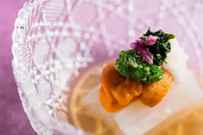 two food items sitting on top of a glass plate at Hotel Metropolitan Edmont Tokyo in Tokyo