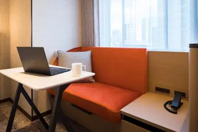 a laptop computer sitting on a desk in a room at Hotel Metropolitan Edmont Tokyo in Tokyo