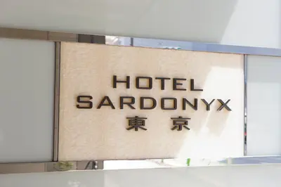 a sign for a hotel sardinianatown at Hotel Sardonyx Tokyo in Tokyo