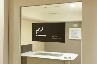 a mirror in a bathroom with a sign on the wall at Hotel Sardonyx Tokyo in Tokyo