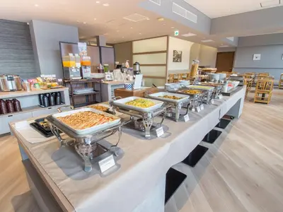a buffet line with trays of food on display at Hearton Hotel Higashi-Shinagawa in Tokyo