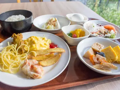 a tray with plates of food on a table at Hearton Hotel Higashi-Shinagawa in Tokyo