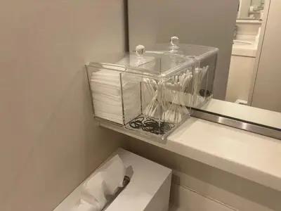 a bathroom with a glass container with toilet paper at Glansit Akihabara in Tokyo
