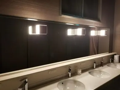 a bathroom with two sinks and a large mirror at Glansit Akihabara in Tokyo