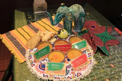 a table with a plate of food on a table at Henn na Hotel Tokyo Asakusabashi in Tokyo