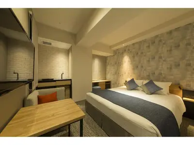 a hotel room with a bed and a table at Tokyu Stay Takanawa Shinagawa Area in Tokyo