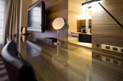 a living room with a tv and a mirror at Tokyo Green Palace in Tokyo
