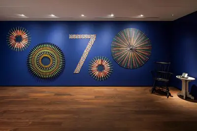 a room with a blue wall with a number seventysix at Hyatt Centric Ginza Tokyo in Tokyo