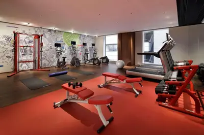 a gym with several exercise equipment in a room at Hyatt Centric Ginza Tokyo in Tokyo