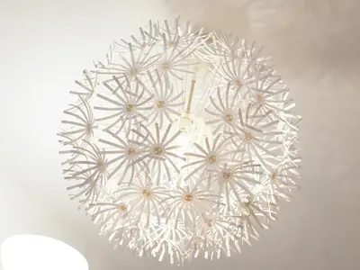 a white chandelier hanging from a ceiling at THE HOUSE Ikebukuro Sugamo in Tokyo