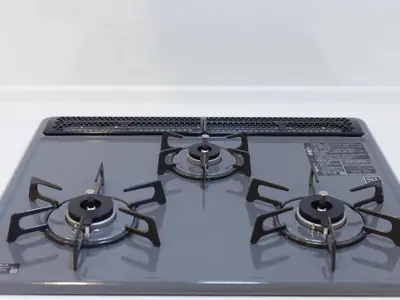 a stove top with three burners on top of it at THE HOUSE Ikebukuro Sugamo in Tokyo