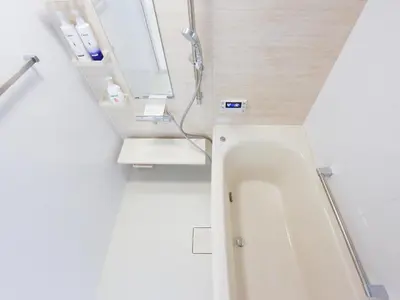 a bathroom with a shower and a white tub at THE HOUSE Ikebukuro Sugamo in Tokyo