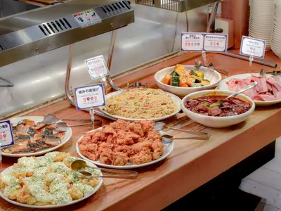 a buffet with different types of food on a table at Nishitetsu Inn Shinjuku in Tokyo