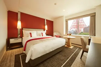 a hotel room with a large bed and a window at Tokyo Prince Hotel in Tokyo