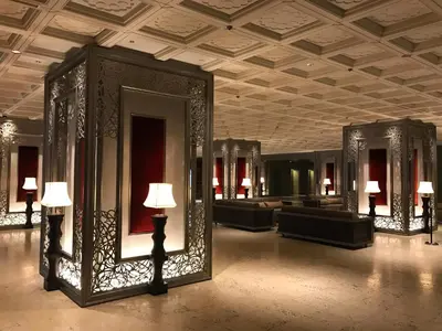a lobby with mirrors and couches in a building at Tokyo Prince Hotel in Tokyo