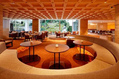a restaurant with tables and chairs in a room at Tokyo Prince Hotel in Tokyo