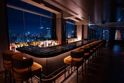 a bar with a view of a city at night at The Prince Park Tower Tokyo - Preferred Hotels & Resorts, LVX Collection in Tokyo