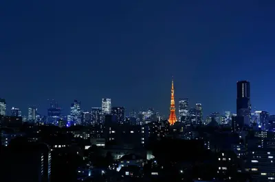 a view of a city at night with a lit up tower at The Prince Sakura Tower Tokyo, Autograph Collection in Tokyo