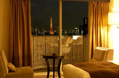 a room with a window with a view of the eiffel tower at Grand Prince Hotel Shin Takanawa in Tokyo