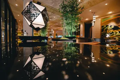 a lobby with black and white lights and a table at Grand Prince Hotel Shin Takanawa in Tokyo