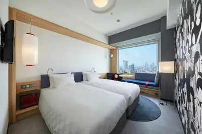 a hotel room with a bed and a window at Shinagawa Prince Hotel in Tokyo