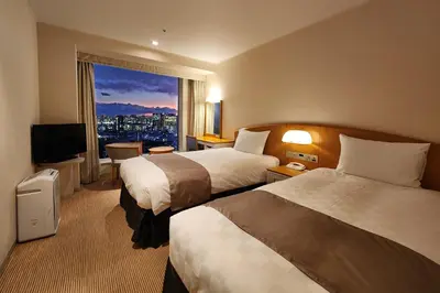 a hotel room with two beds and a window at Shinagawa Prince Hotel in Tokyo
