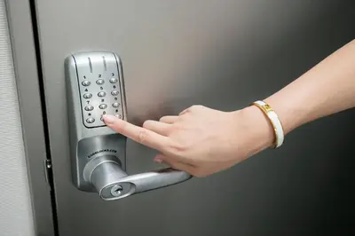 a woman pressing a door handle with her hand at La Krasse Sumida in Tokyo