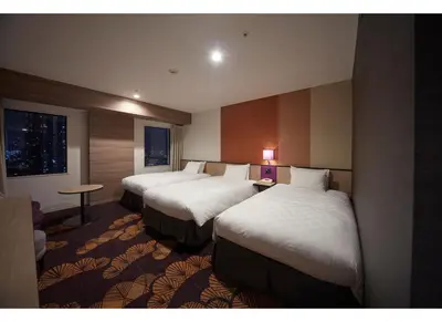 a hotel room with two beds and a window at Sunshine City Prince Hotel Ikebukuro Tokyo in Tokyo