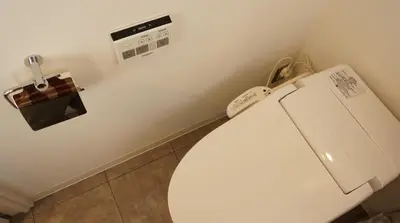 a bathroom with a white toilet in a room at Hostel Chapter Two Tokyo in Tokyo
