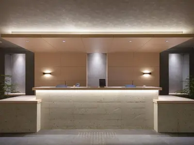 a lobby with a reception desk in a building at MIMARU Tokyo Ueno North in Tokyo