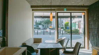 a restaurant with a table and chairs and a window at Sumida Nagaya in Tokyo