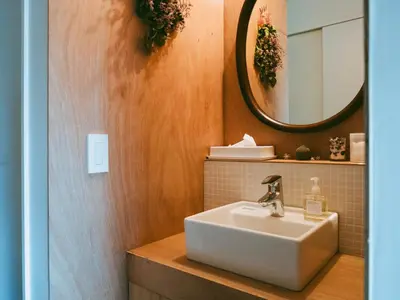 a bathroom with a sink and a mirror at Sumida Nagaya in Tokyo