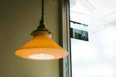 an orange light hanging in front of a window at Sumida Nagaya in Tokyo
