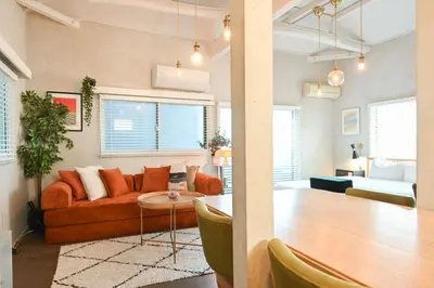a living room with a couch and a table at 846 apartment in Tokyo