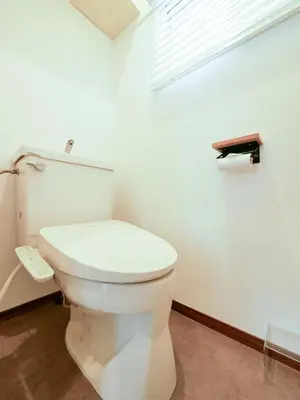 a white toilet in a bathroom with a window at 846 apartment in Tokyo