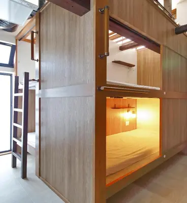 ajar room with a bunk bed in a room at Hostel Kura in Tokyo