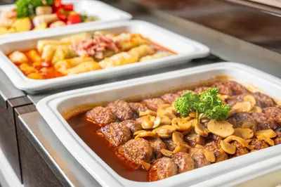 three styrofoam containers of food with meat and mushrooms at HOTEL MYSTAYS Maihama in Urayasu