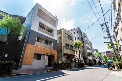a building on the side of a street at Sakura Cross Hotel Ueno Iriya in Tokyo