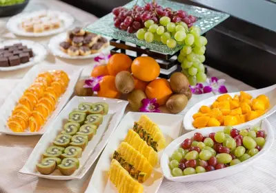 a table filled with different types of fruits and snacks at Hotel Monterey Hanzomon in Tokyo