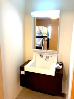 a bathroom with a sink and a mirror at Tokyo Art House in Tokyo
