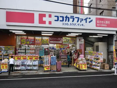 a store on a street with people walking in front of it at COTO Tokyo Shibuya 3 in Tokyo