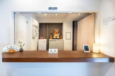 a mirror on top of a table in a room at Nihonbashi Kakigara Ryokan in Tokyo