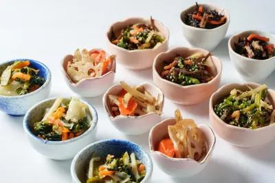 a group of small bowls of food on a table at Premier Hotel Cabin Shinjuku in Tokyo